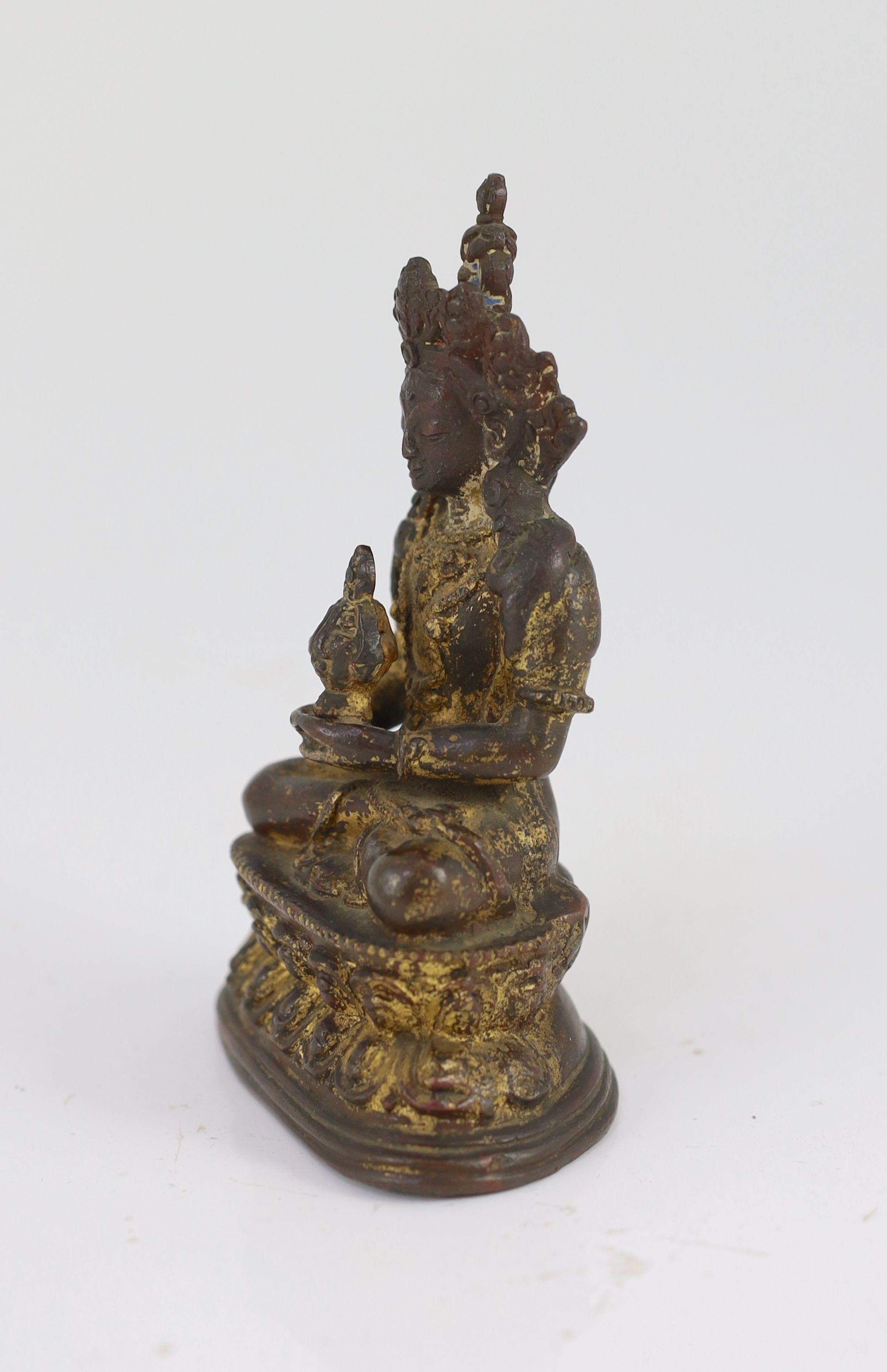 A Tibetan gilt copper alloy figure of Amitayus, 16th/17th century, 14cm high